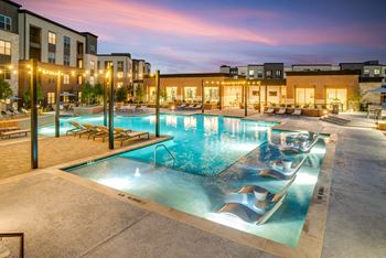 Resort-style swimming pool with sunning ledge, plunge pools, cabanas, and fire pit